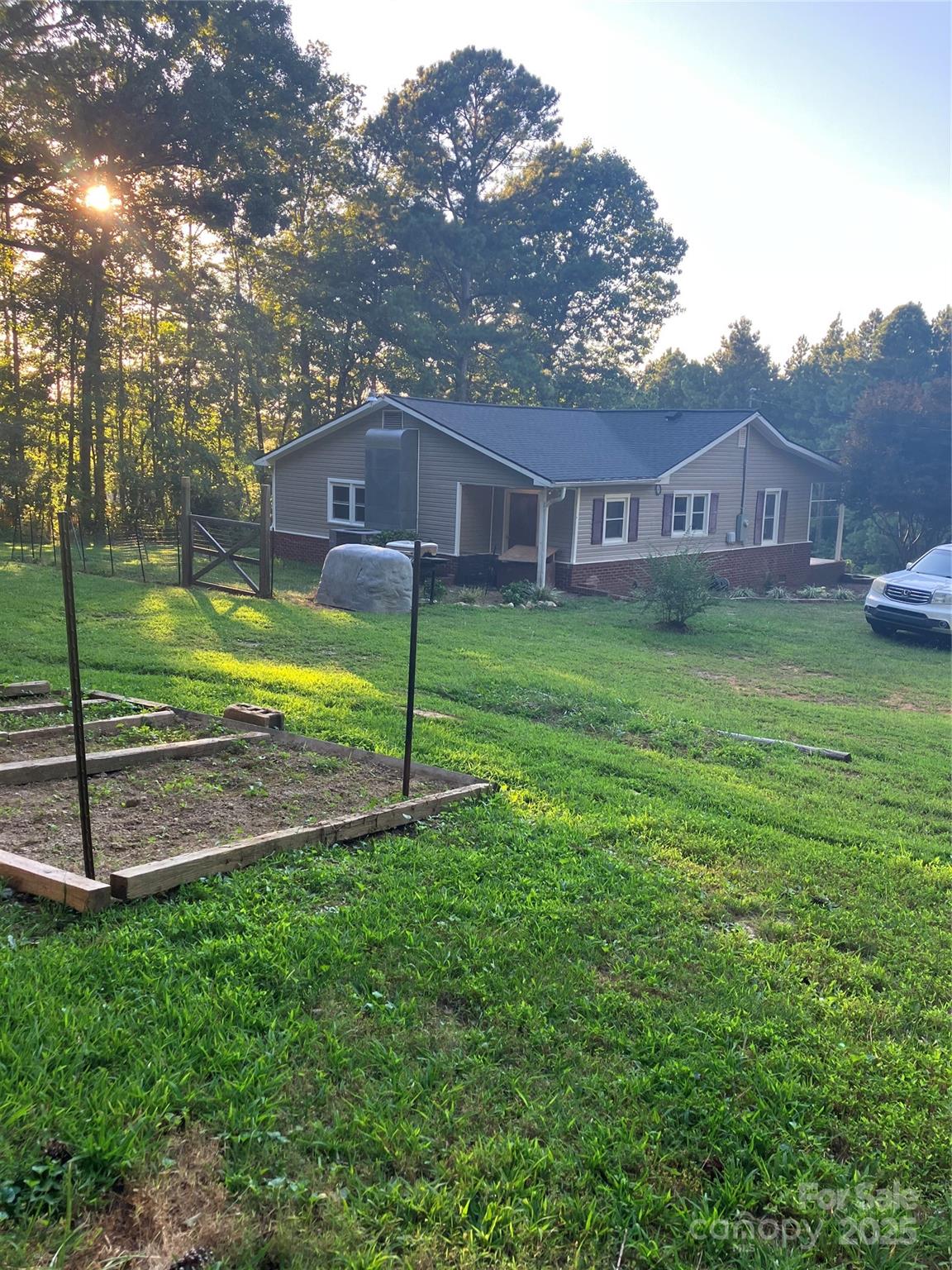 36704 Mauldin Road Albemarle, NC 28001 - Photo 11 of 33 a backyard of a house with table and chairs
