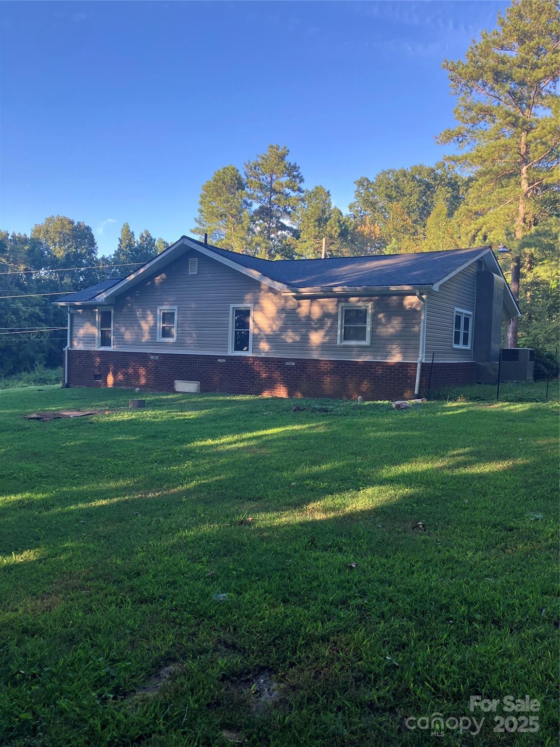 36704 Mauldin Road Albemarle, NC 28001 - Photo 2 of 33 a view of house with a big yard