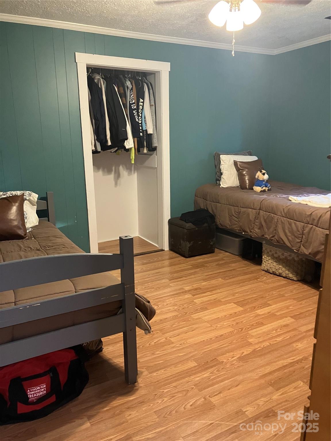 36704 Mauldin Road Albemarle, NC 28001 - Photo 31 of 33 a bedroom with a bed and cabinets