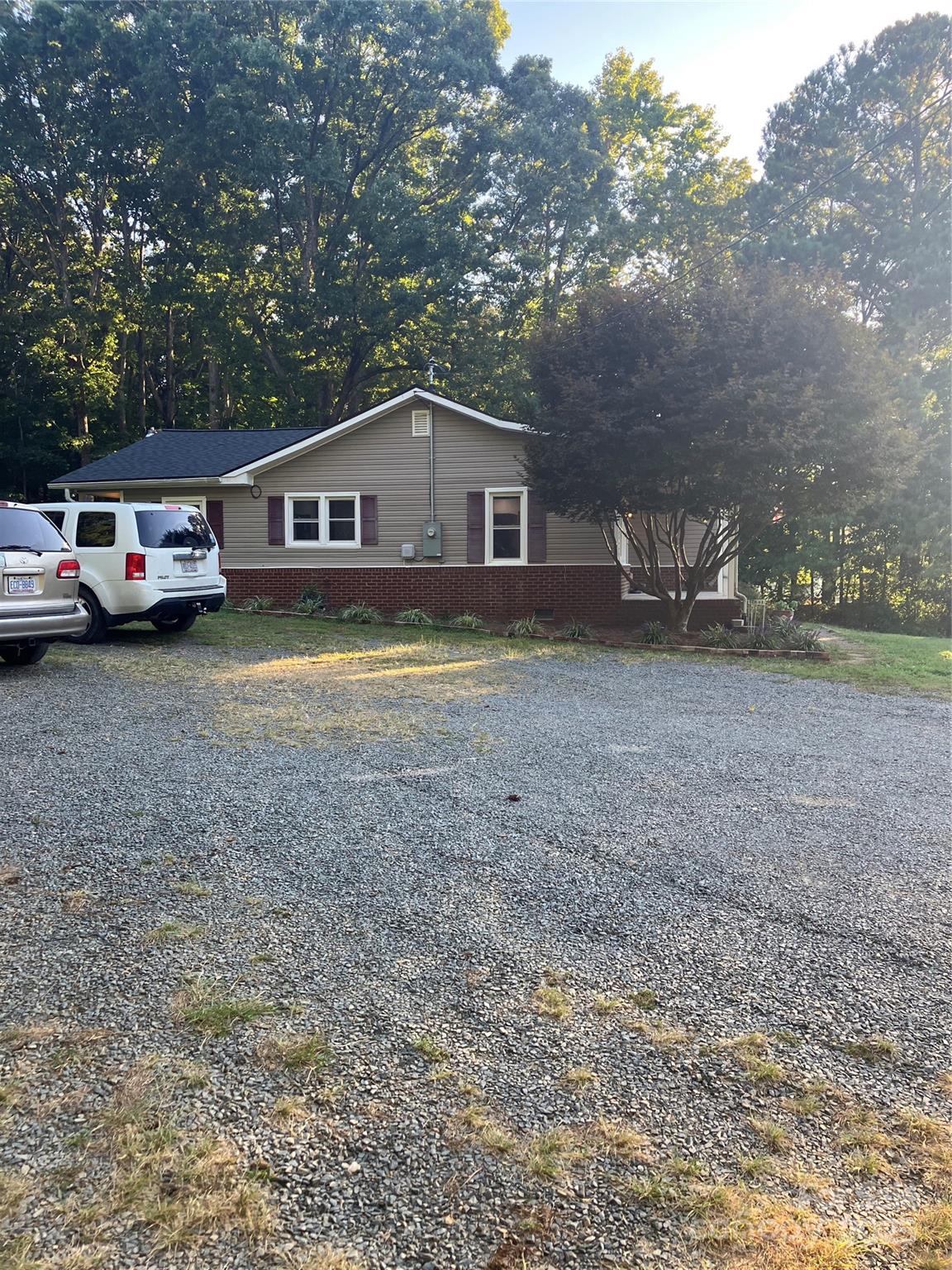 36704 Mauldin Road Albemarle, NC 28001 - Photo 4 of 33 a house with a truck parked in front of a house
