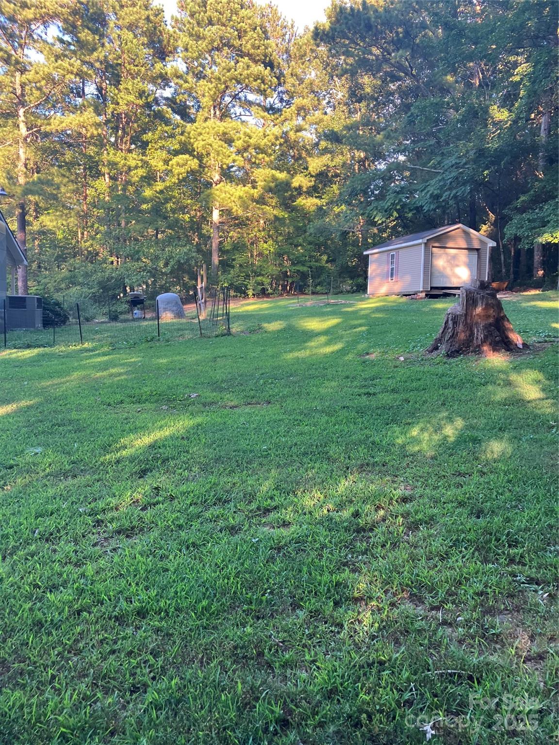 36704 Mauldin Road Albemarle, NC 28001 - Photo 7 of 33 a view of a house with a big yard and large trees