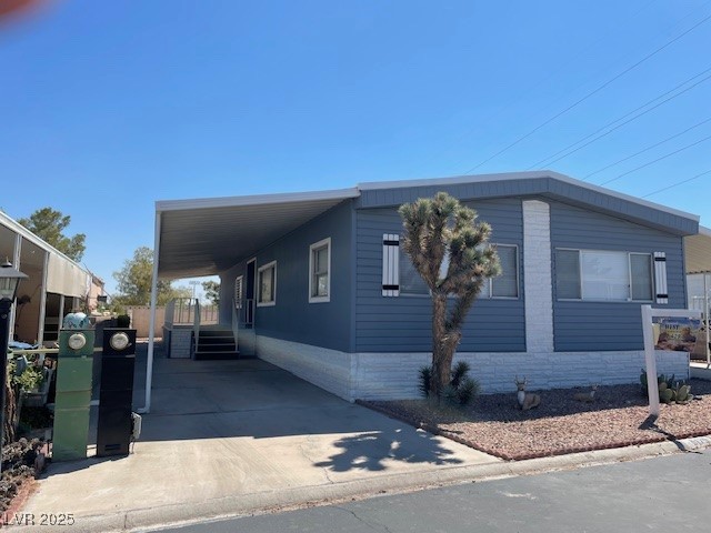 5175 Ridge Drive, Unit 149 Las Vegas, NV 89103 - Photo 1 of 33 Manufactured / mobile home with a carport and concrete driveway
