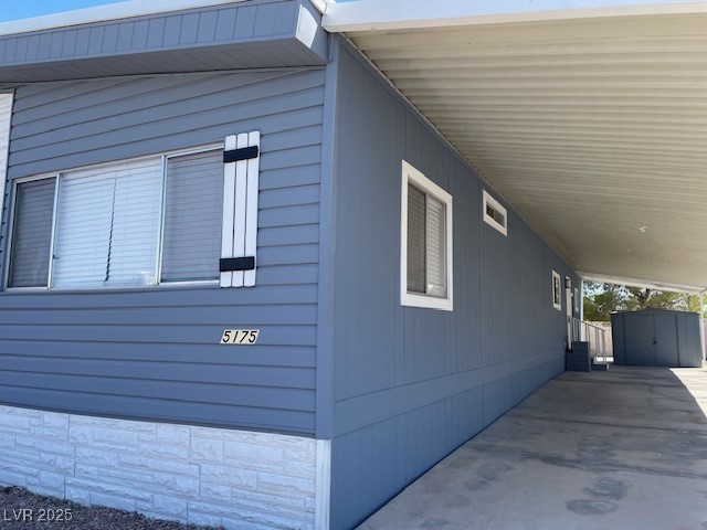 5175 Ridge Drive, Unit 149 Las Vegas, NV 89103 - Photo 5 of 33 View of property exterior with a storage unit and a carport