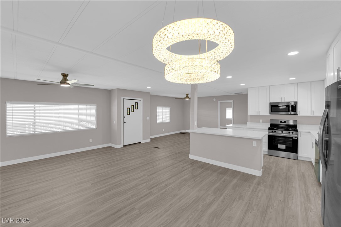5175 Ridge Drive, Unit 149 Las Vegas, NV 89103 - Photo 32 of 33 Kitchen featuring ceiling fan, open floor plan, white cabinets, stainless steel appliances, and recessed lighting