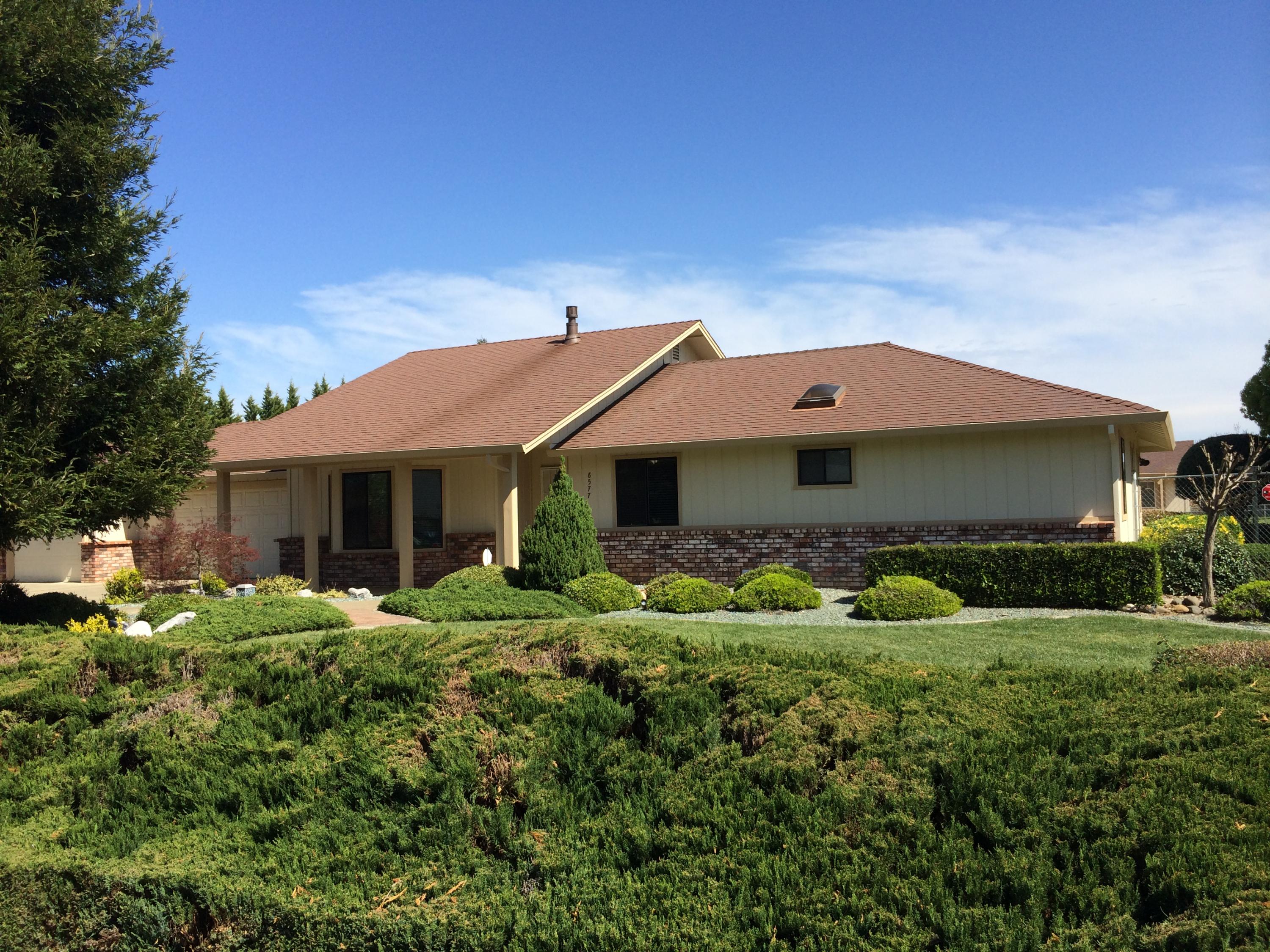 6577 Flicker Way Anderson, CA 96007 - Photo 1 of 41 a front view of a house with garden