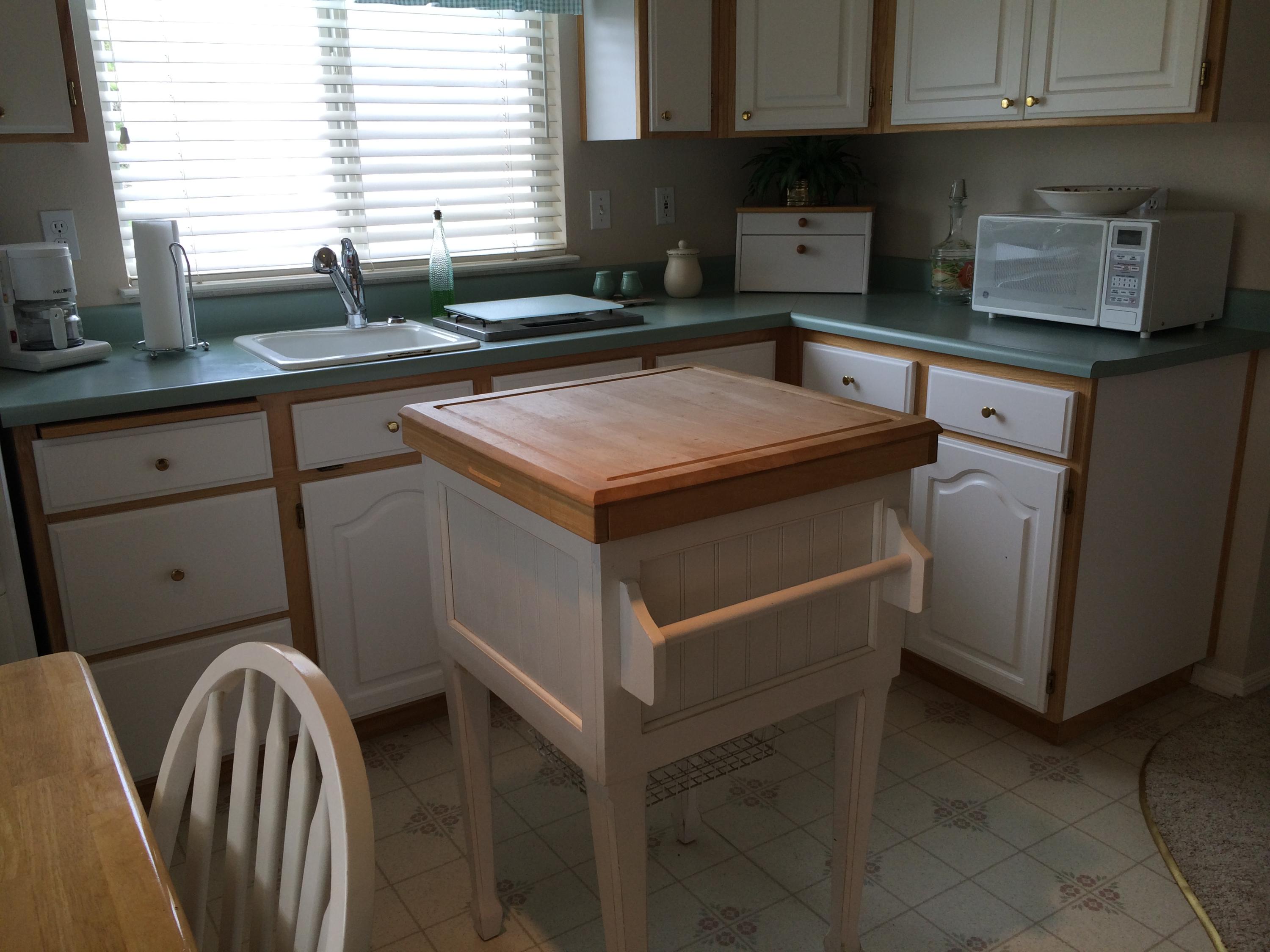 6577 Flicker Way Anderson, CA 96007 - Photo 11 of 41 a kitchen with stainless steel appliances granite countertop a sink stove and cabinets