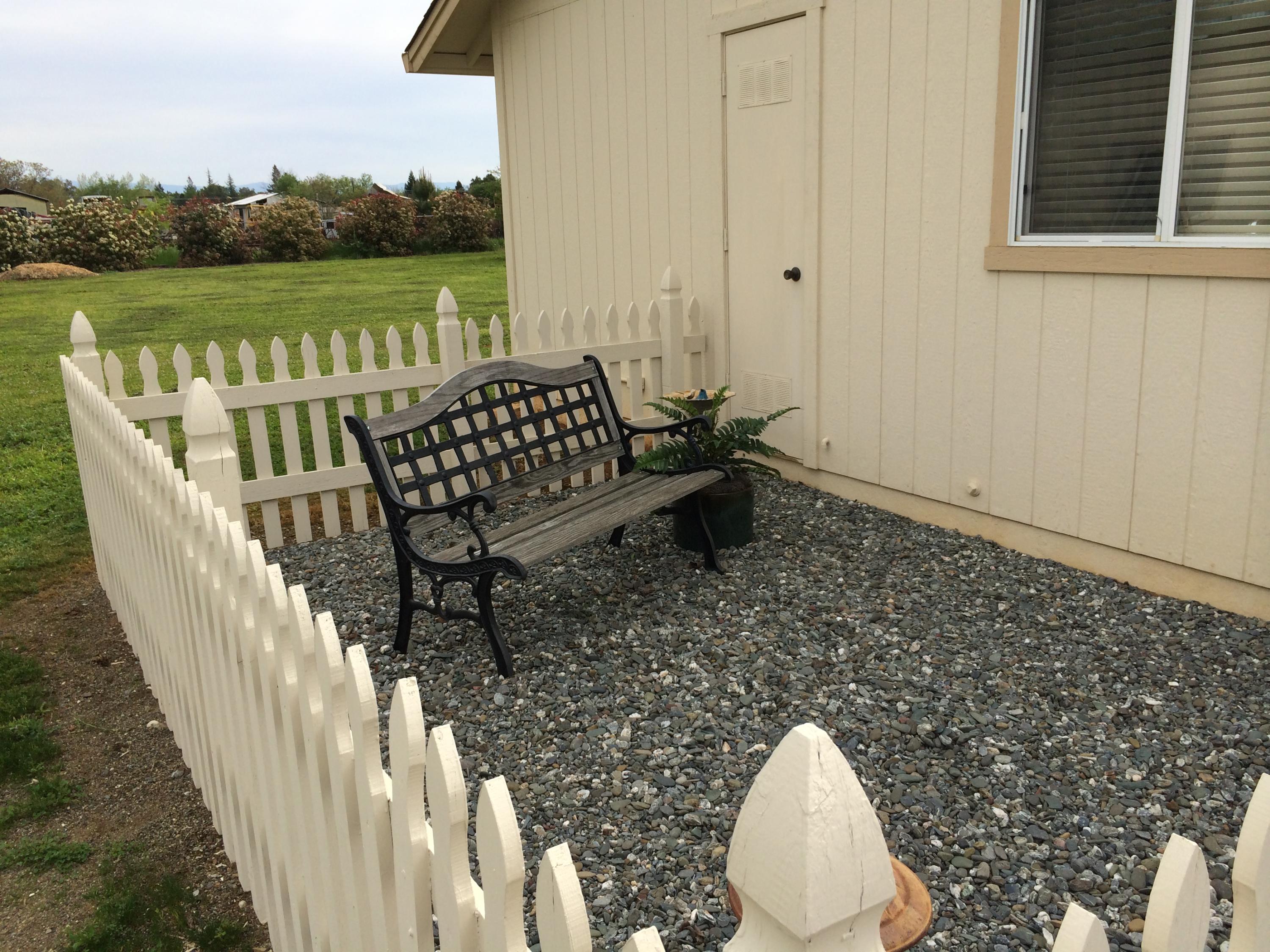 6577 Flicker Way Anderson, CA 96007 - Photo 12 of 41 a view of a balcony with wooden floor and lake view