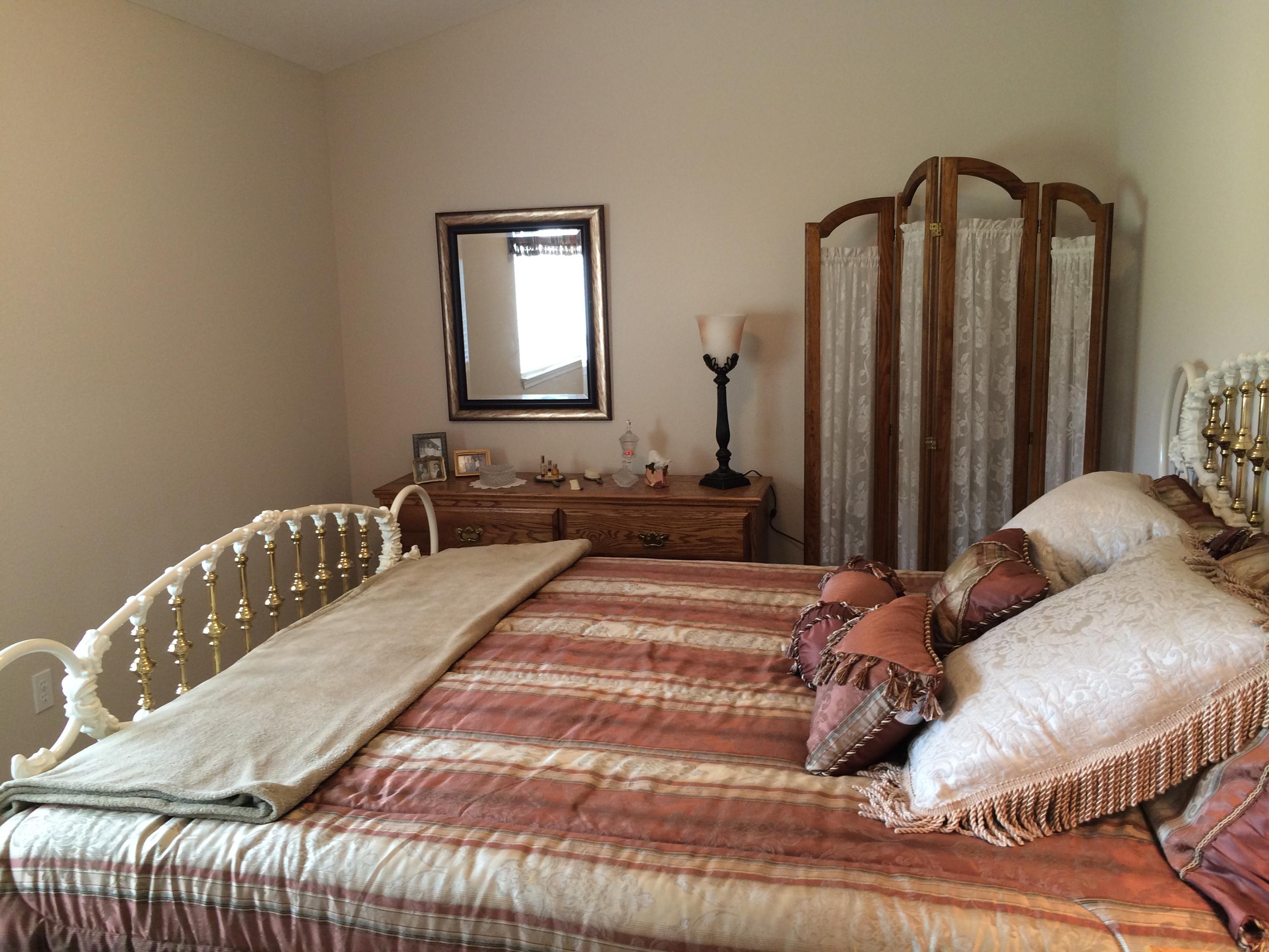 6577 Flicker Way Anderson, CA 96007 - Photo 8 of 41 a bedroom with a bed and a mirror