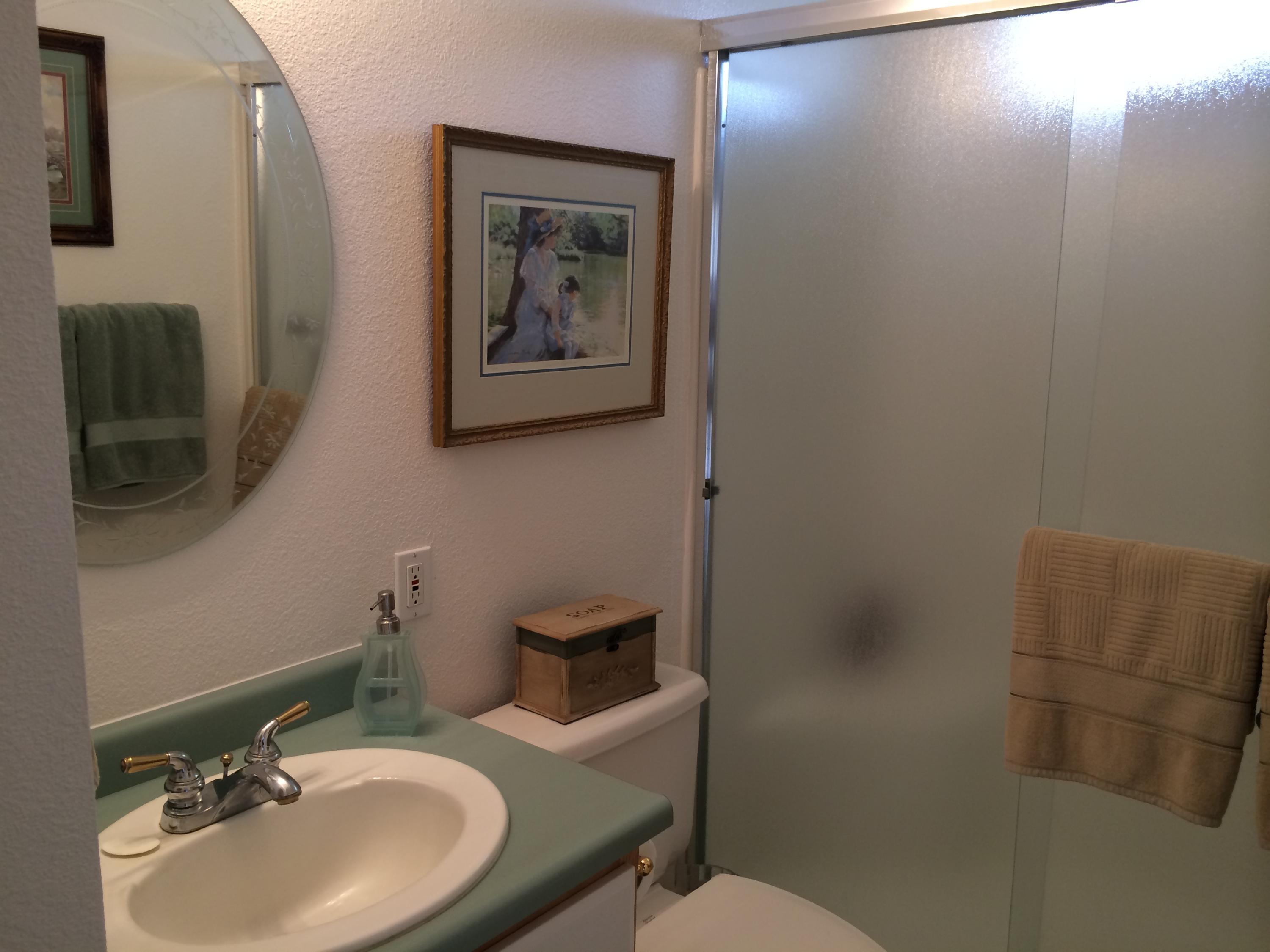 6577 Flicker Way Anderson, CA 96007 - Photo 9 of 41 a bathroom with a toilet sink and mirror