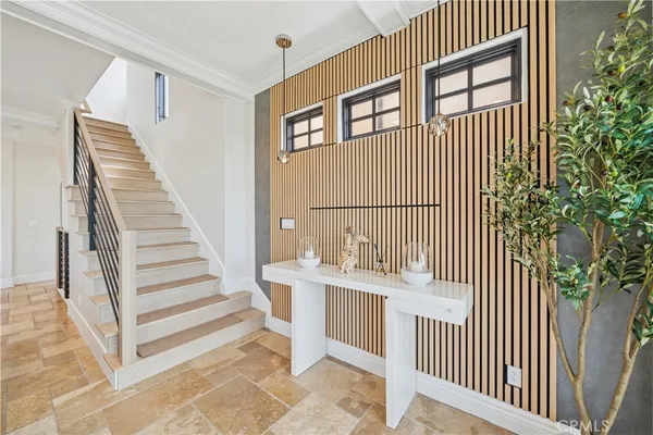 a large bedroom with a large bed and a flat screen tv