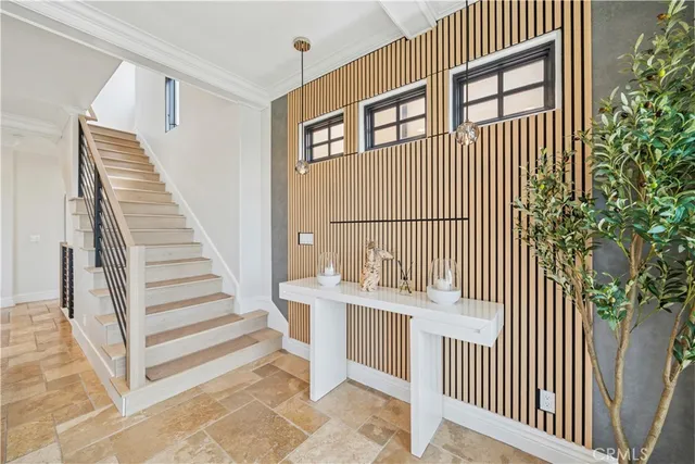 a large bedroom with a large bed and a flat screen tv