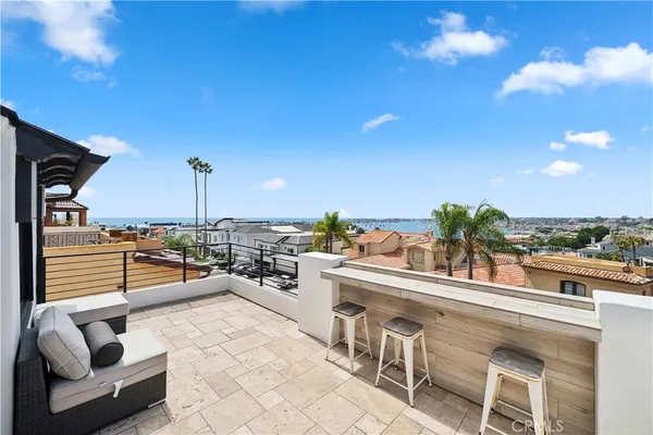 a living room with furniture a floor to ceiling window and a flat screen tv
