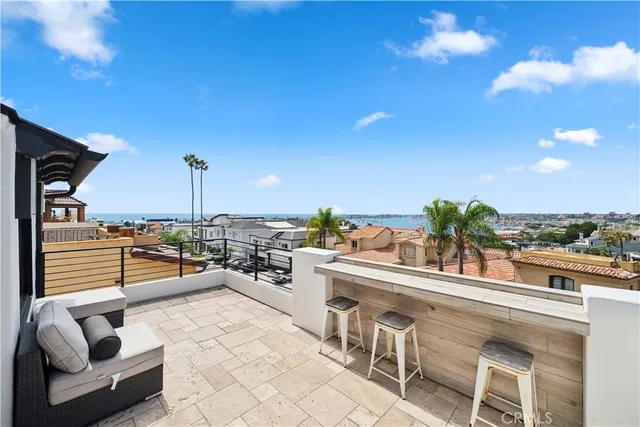 a living room with furniture a floor to ceiling window and a flat screen tv
