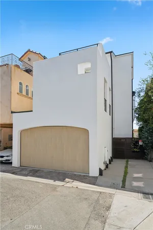 a view of a patio with couches and potted plants