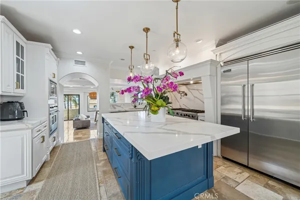 a kitchen with a refrigerator and countertop