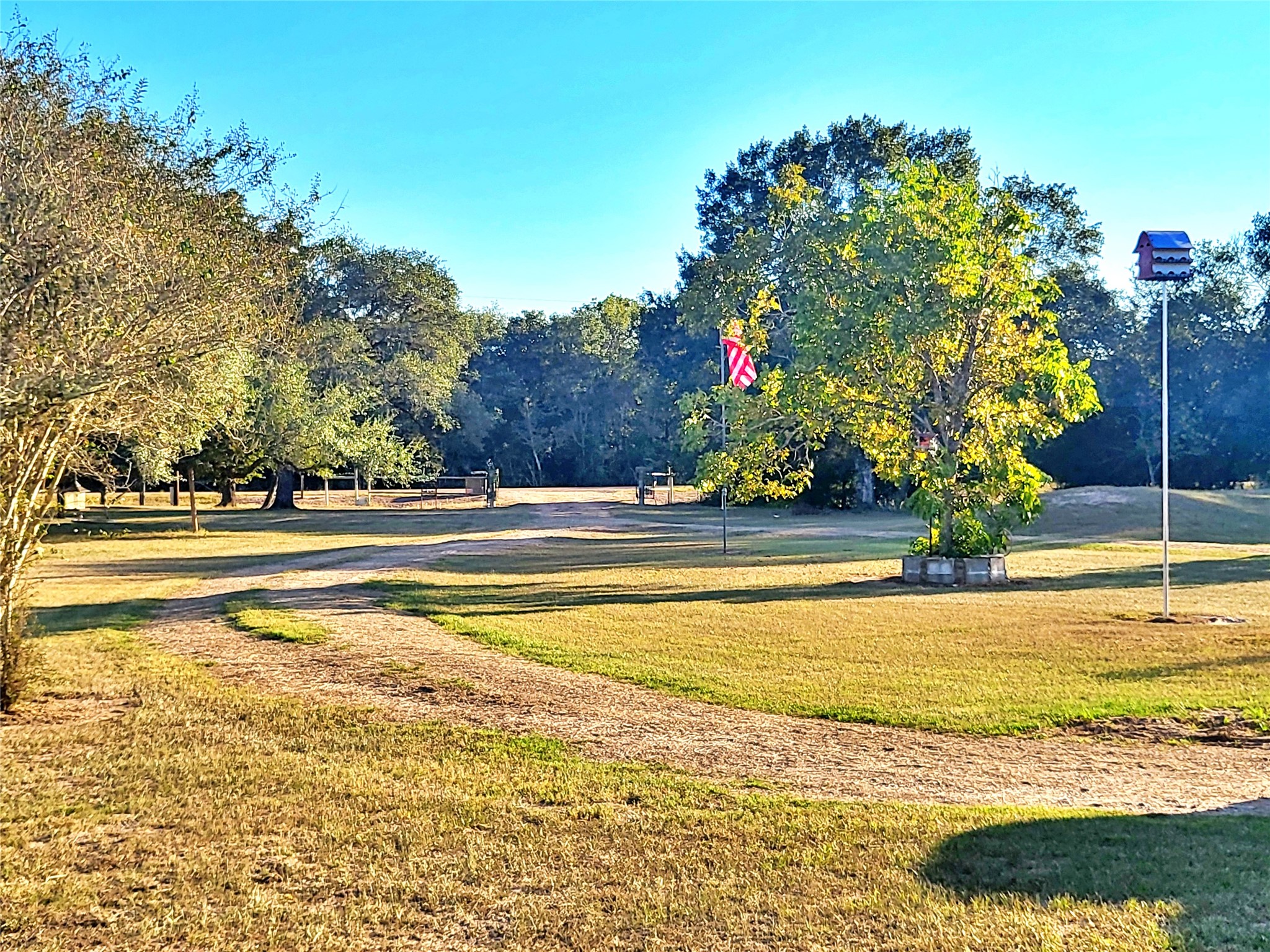1085 Reeves Road Garwood, TX 77442 - Photo 15 of 28 a view of a fountain in front of a house