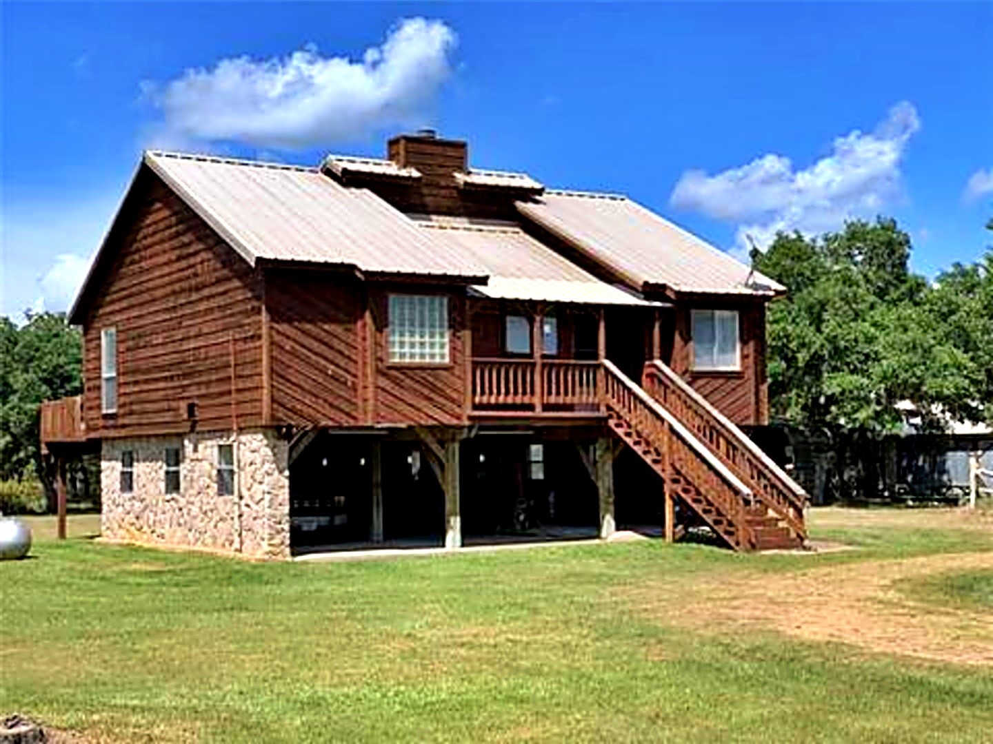 1085 Reeves Road Garwood, TX 77442 - Photo 19 of 28 a front view of a house with a yard