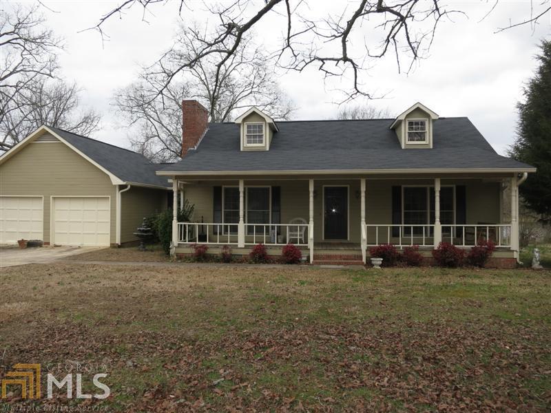 1543 Old Dalton Road Northeast Rome, GA 30165 - Photo 1 of 1 a front view of a house with a garden