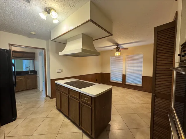 a kitchen with a stove and a sink
