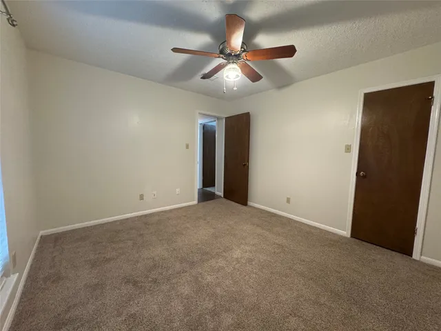 a view of a livingroom with a ceiling fan
