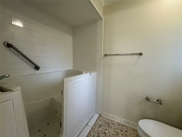 a bathroom with a sink and toilet
