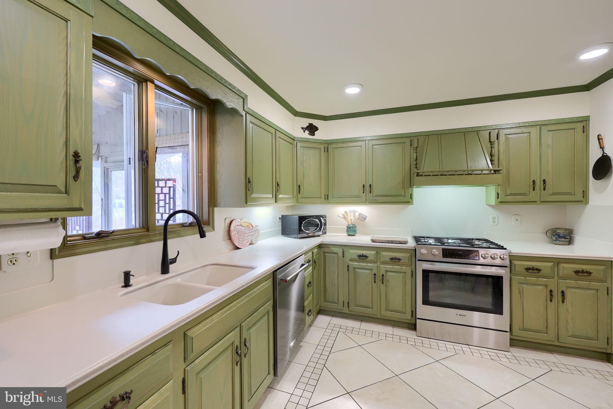412 Wetherburn Drive Lancaster, PA 17601 - Photo 11 of 37 a kitchen with a sink stove and cabinets