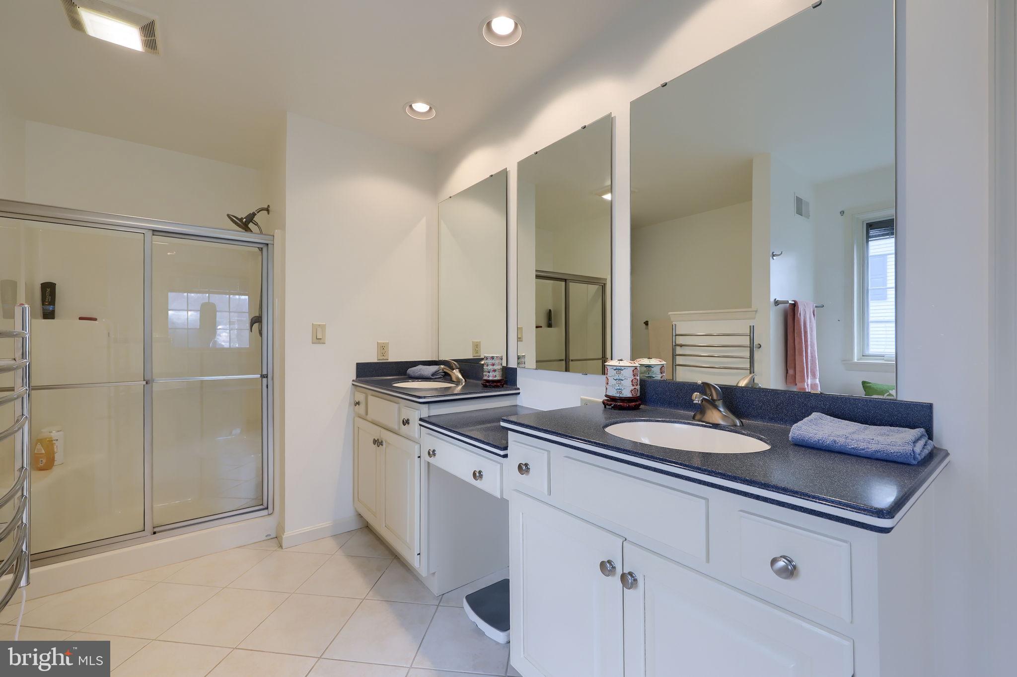 412 Wetherburn Drive Lancaster, PA 17601 - Photo 19 of 37 a spacious bathroom with a granite countertop sink a mirror and a shower