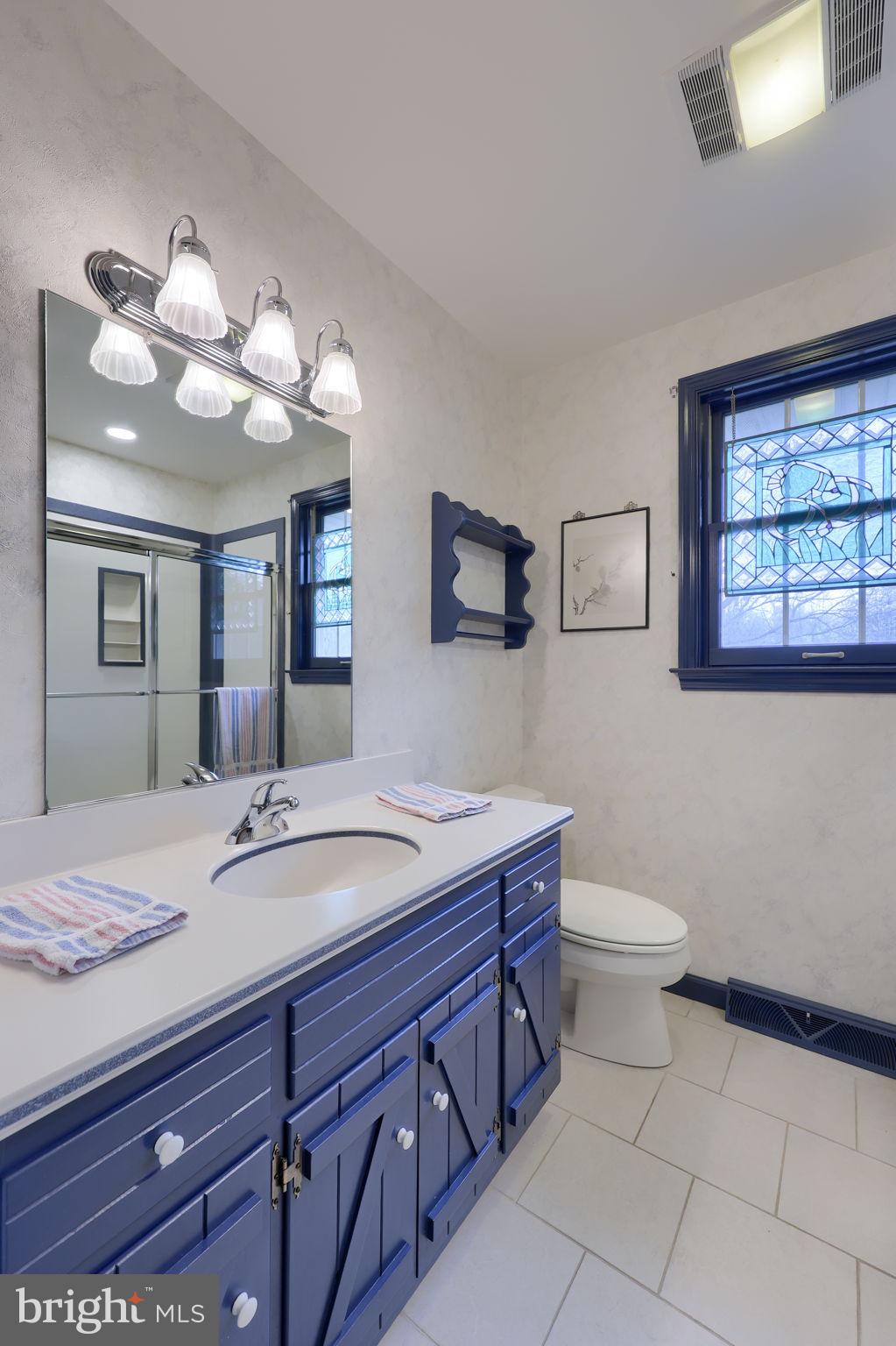 412 Wetherburn Drive Lancaster, PA 17601 - Photo 28 of 37 a spacious bathroom with a granite countertop toilet sink and mirror