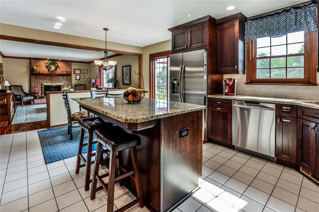 261 Pinkerton Road Wexford, PA 15090 - Photo 3 of 25 Updated Kitchen w/Granite Countertops, 42" Cabinets, Stainless Appliances, Double Oven Stove, Recessed Lighting & Ceramic Tile Flooring.