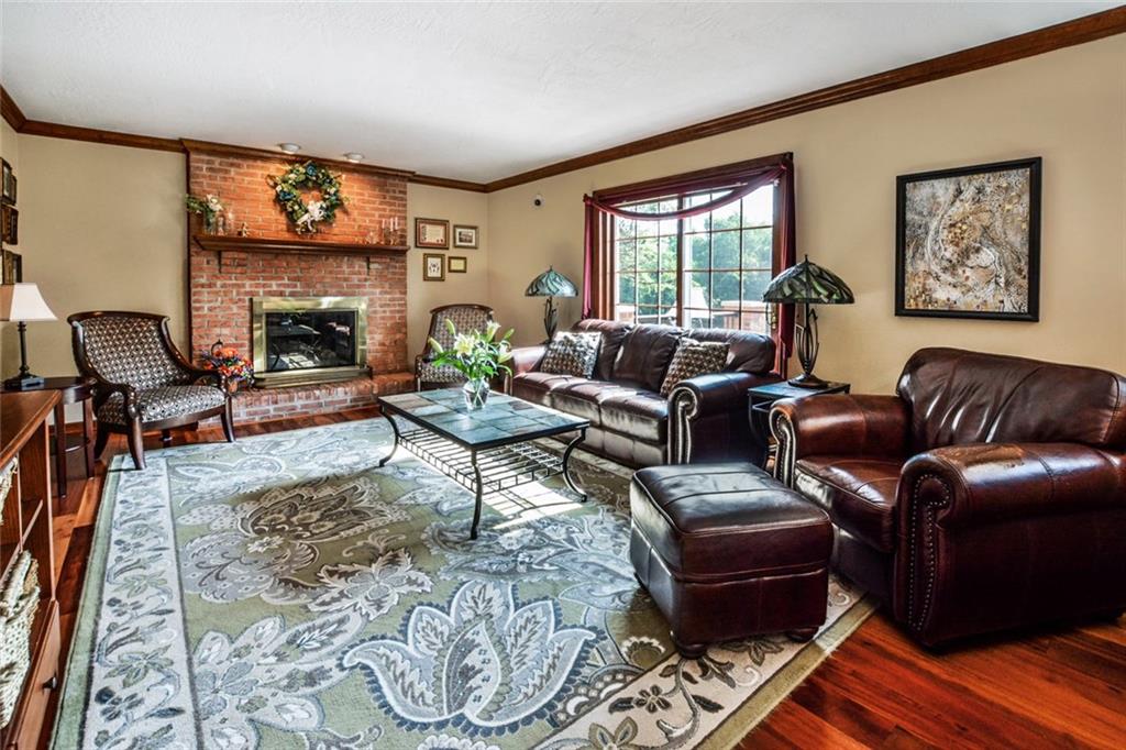 261 Pinkerton Road Wexford, PA 15090 - Photo 5 of 25 Family Room w/Hardwood Floors, Gas Fireplace & Mantle, Crown Moldings and Recessed Lighting Above Fireplace.