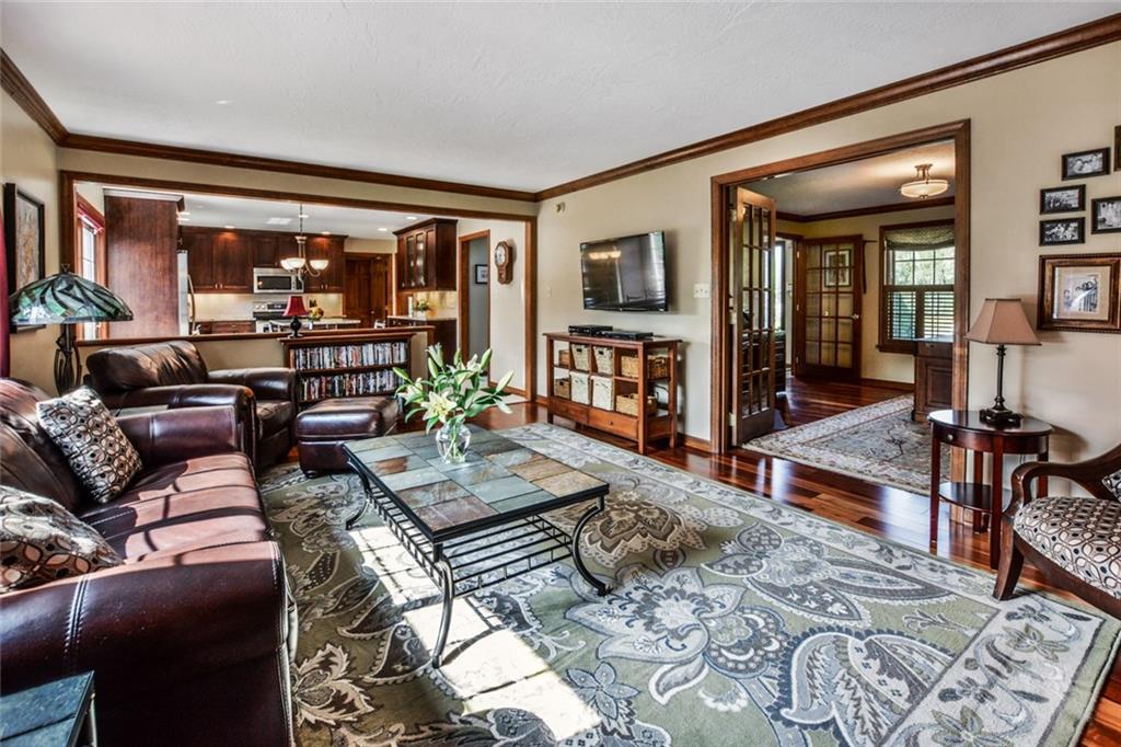 261 Pinkerton Road Wexford, PA 15090 - Photo 6 of 25 Family Room w/Hardwood Floors, Gas Fireplace & Mantle, Crown Moldings and Recessed Lighting Above Fireplace.