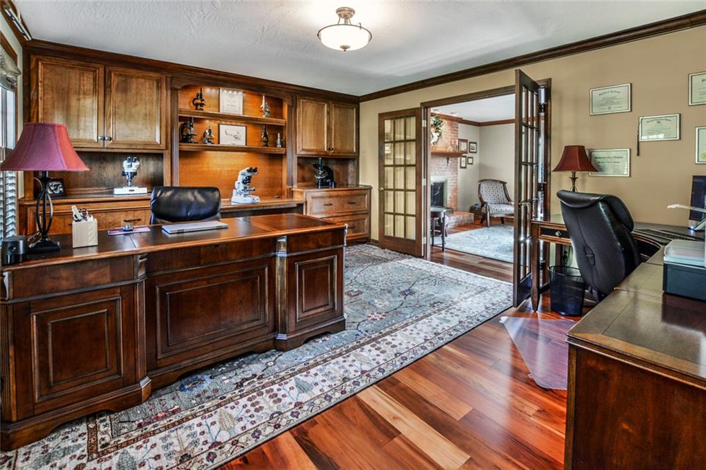 261 Pinkerton Road Wexford, PA 15090 - Photo 9 of 25 Den w/Hardwood Floors, Custom Cabinets & Shelf's, French Doors & Crown Moldings.