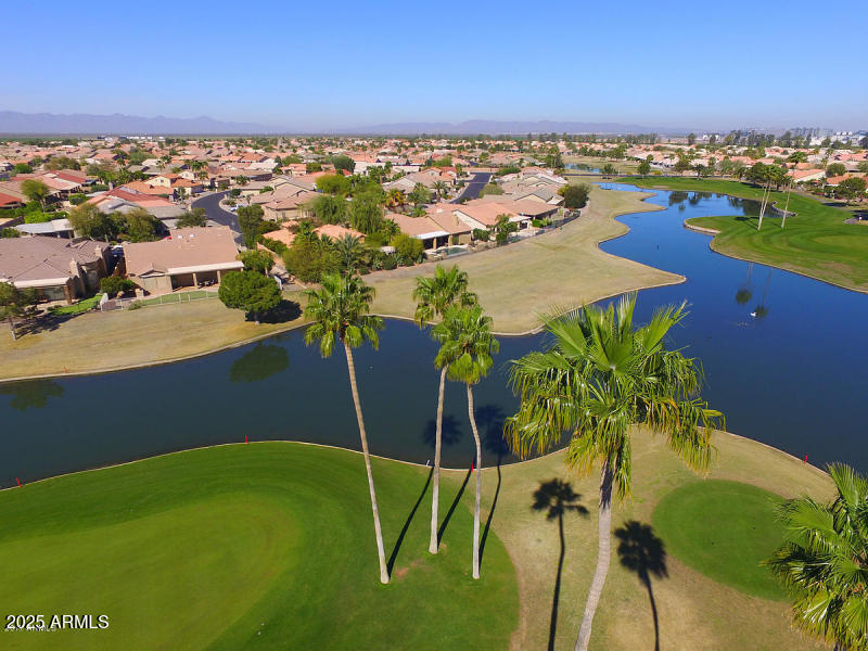 23745 South Vacation Way Sun Lakes, AZ 85248 - Photo 39 of 52 a view of a lake with a city