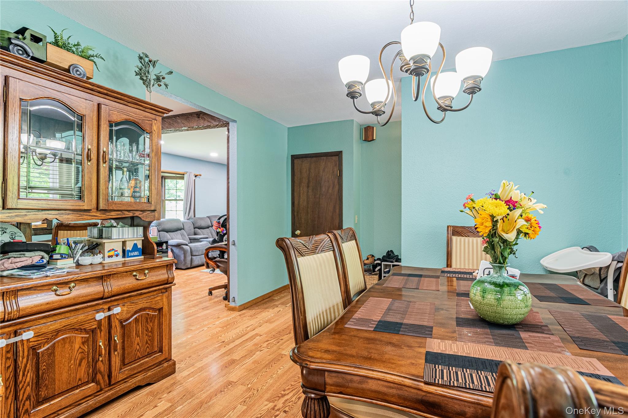 6 Swain Road Pleasant Valley, NY 12569 - Photo 20 of 33 a view of a dining room with furniture a chandelier and wooden floor