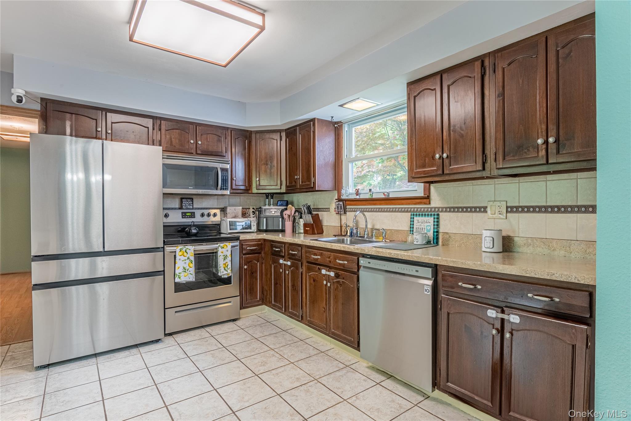 6 Swain Road Pleasant Valley, NY 12569 - Photo 23 of 33 a kitchen with granite countertop stainless steel appliances and wooden cabinets