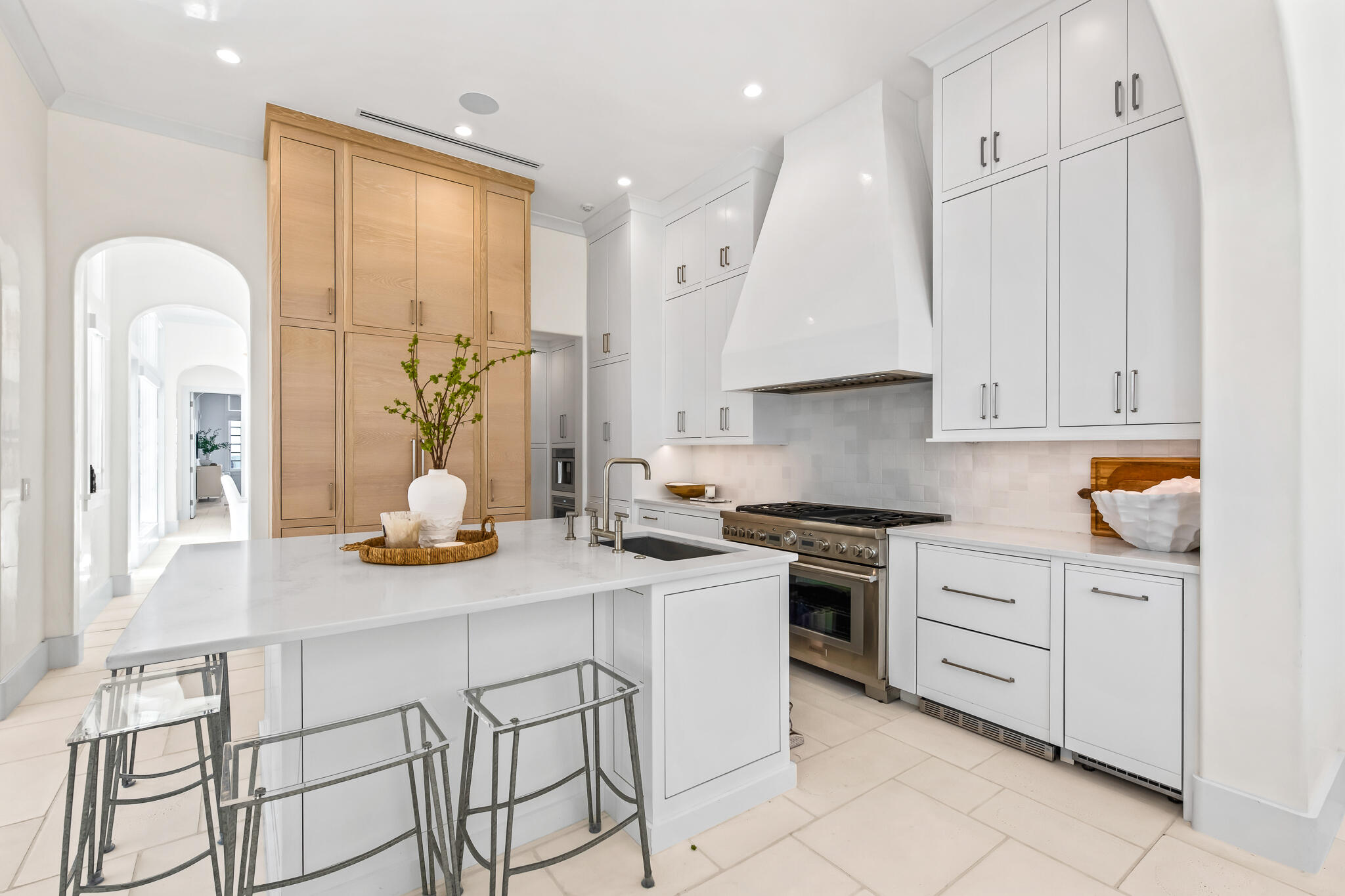 40 Smugglers Alley Inlet Beach, FL 32461 - Photo 11 of 59 a kitchen with stainless steel appliances granite countertop a stove a sink and white cabinets