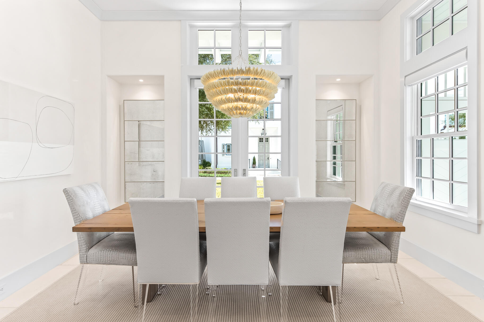 40 Smugglers Alley Inlet Beach, FL 32461 - Photo 12 of 59 a view of a dining room with furniture and a large window
