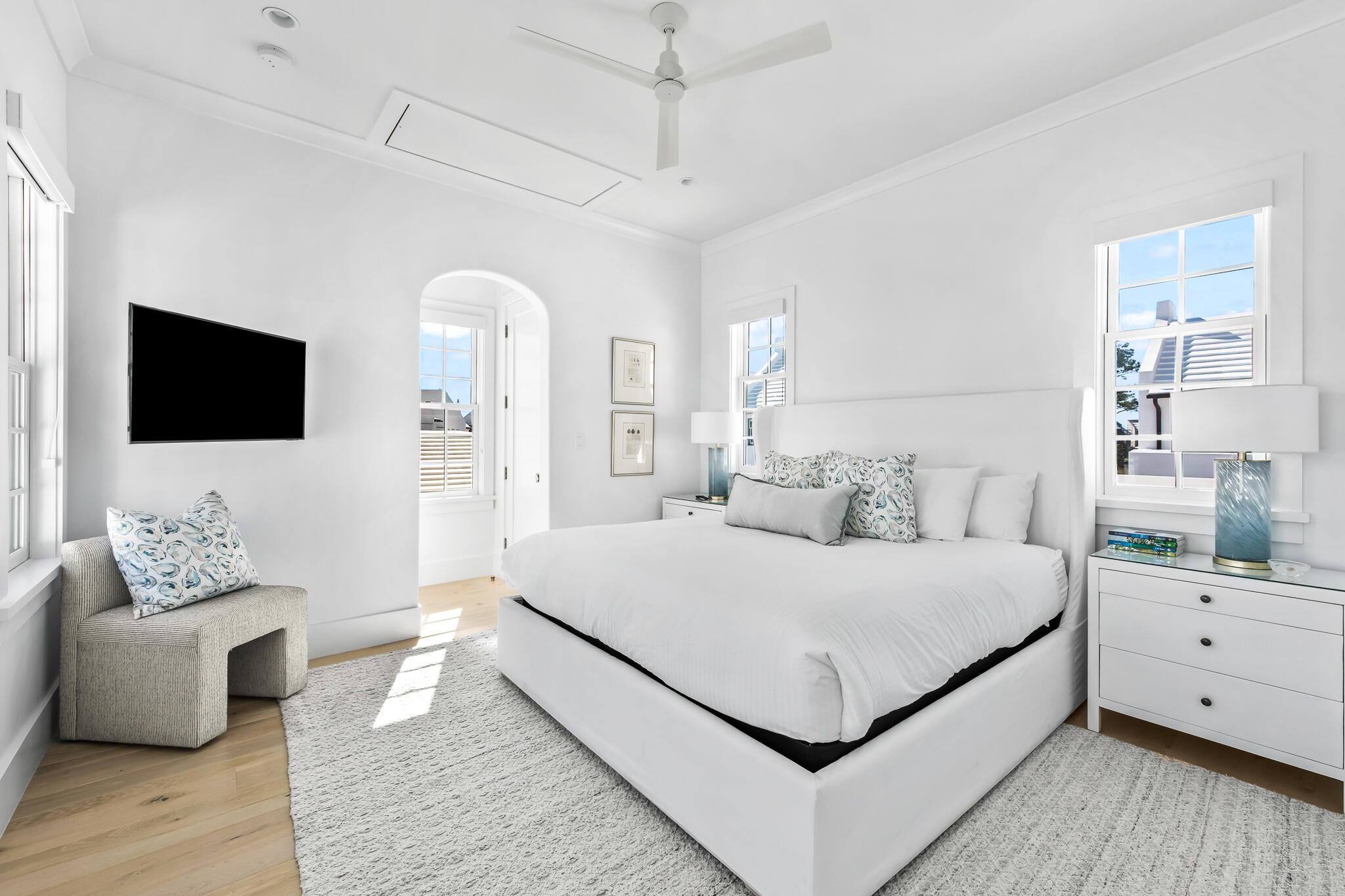 40 Smugglers Alley Inlet Beach, FL 32461 - Photo 22 of 59 a bedroom with a bed wooden floor and flat screen tv