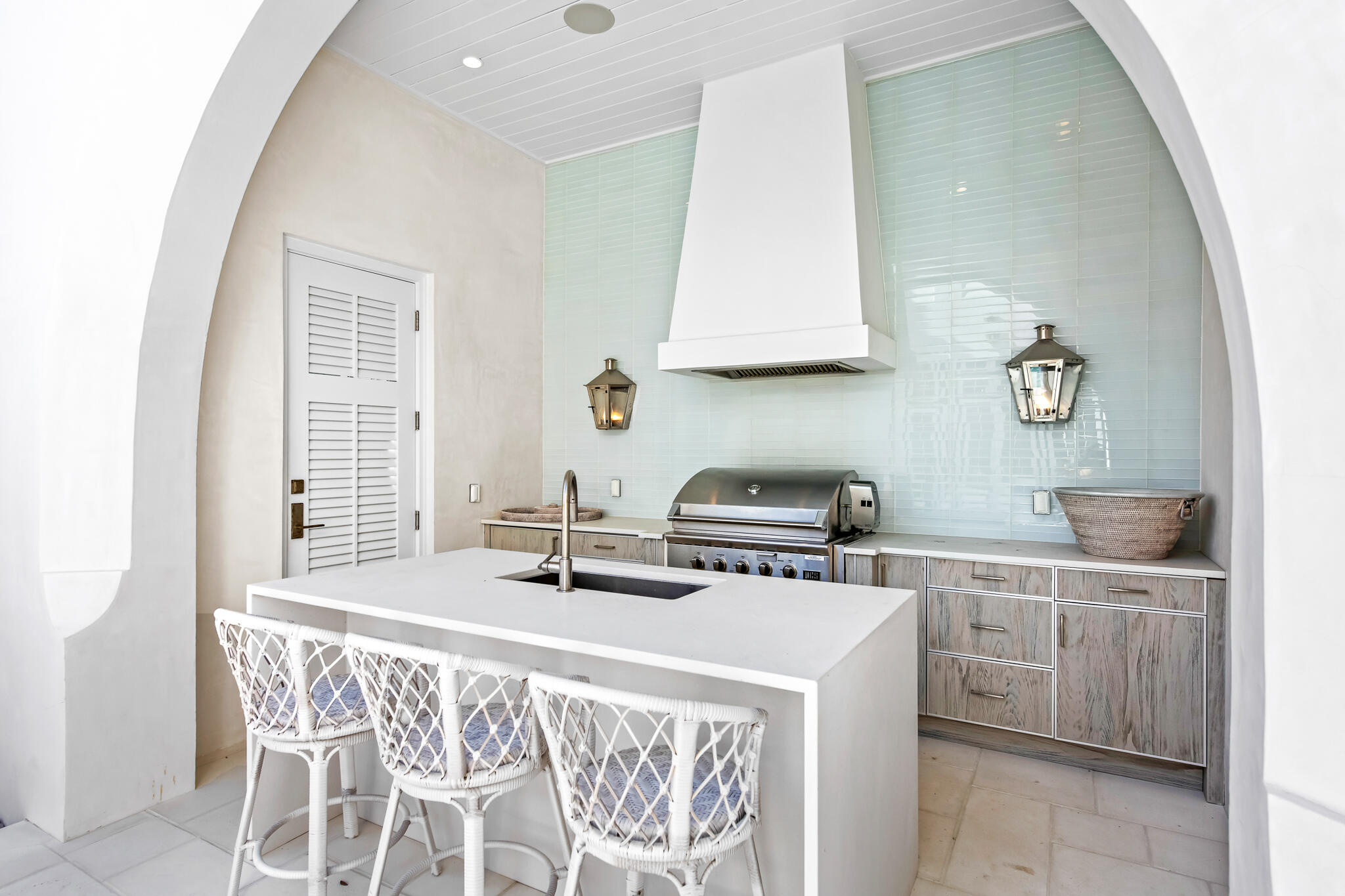 40 Smugglers Alley Inlet Beach, FL 32461 - Photo 27 of 59 a kitchen with a stove a sink and a wooden cabinets