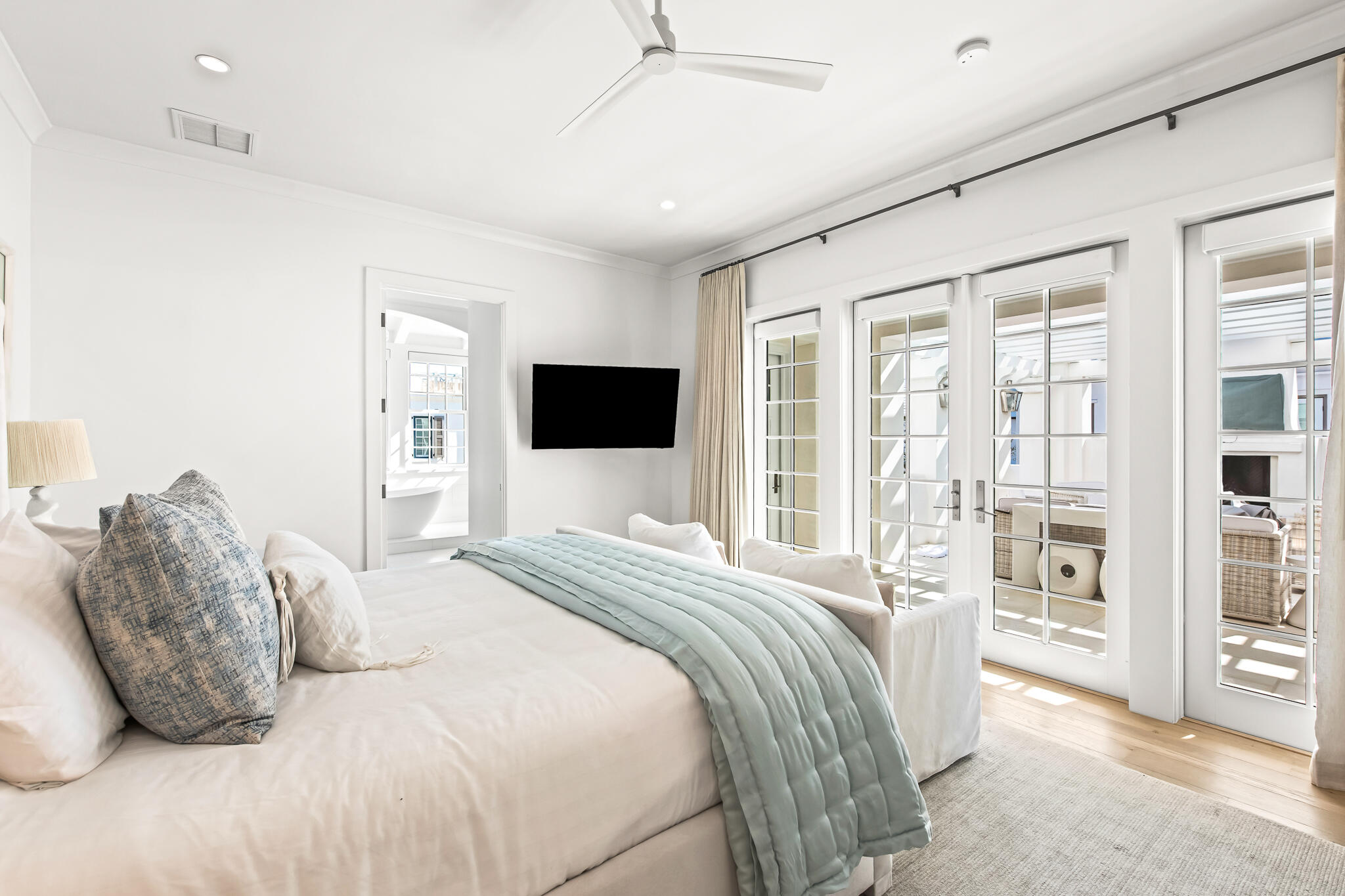 40 Smugglers Alley Inlet Beach, FL 32461 - Photo 33 of 59 a bedroom with a large bed and a flat tv screen