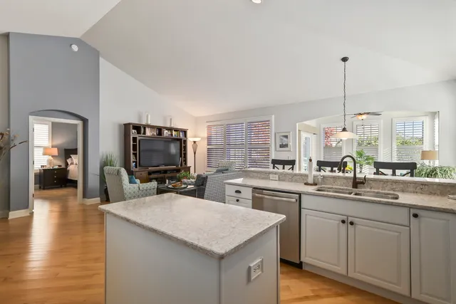 a kitchen with a sink stove and cabinets