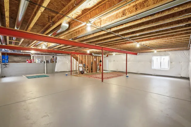 a view of a gym with wooden floor