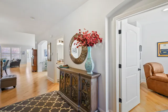 a view of entryway with furniture and wooden floor
