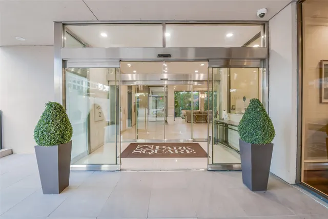 a view of entryway with a floor to ceiling window and stairs