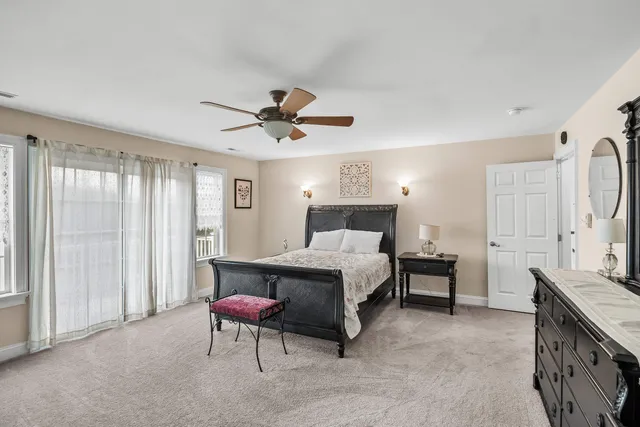 a bedroom with a bed and a fireplace