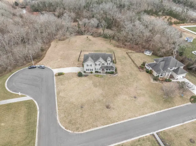 a bathroom with a sink mirror and vanity