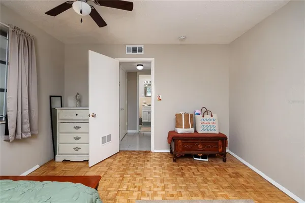 a bedroom with a bed and dresser