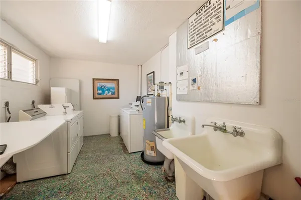 a bathroom with a sink a tub and a mirror