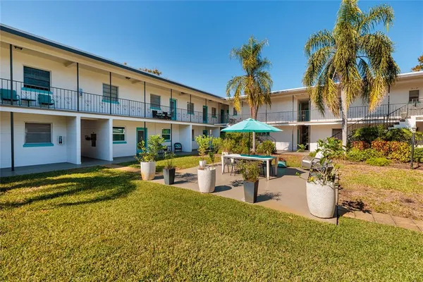 a view of a swimming pool with a patio