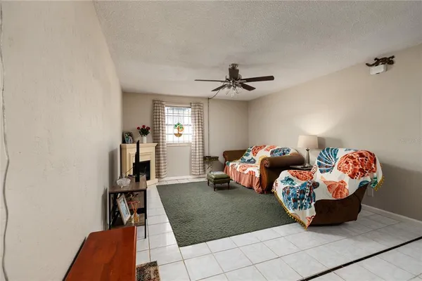 a bed room with furniture and a book shelf